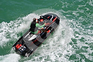 Overhead View of a Man Riding on a Black Jet Ski photo