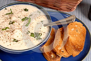 Overhead view of New England Chowder in a blue bowl