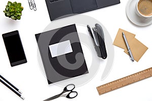 Office Supplies And Devices Arranged On Isolated White Background