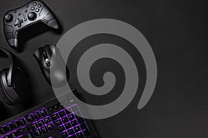 Purple lit keyboard by game controller and mouse