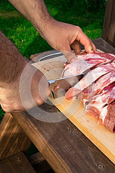 Overhead view of raw piece of pork on wooden background. Piece of fresh boneless pork, neck part or collar. Big piece of red raw m