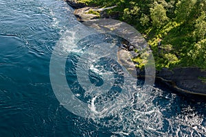 Overhead view of Saltstraumen\'s strong tides and whirlpools near rocky coasts