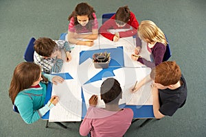Overhead View Of Schoolchildren Working Together photo
