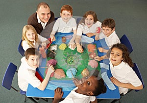 Overhead View Of Schoolchildren Working Together photo