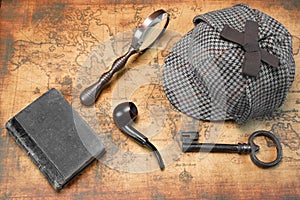 Overhead View Of Sherlock Hat And Detective Tools On Map