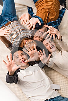 overhead view of smiling multiethnic teens