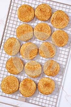 Overhead view of snickerdoodle cookies on a cooling rack