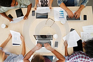 Overhead View Of Staff With Digital Devices In Meeting