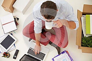 Overhead View Of Start Up Business Moving Into Office photo