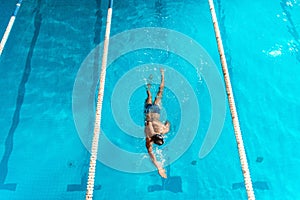 overhead view of swimmer in competition swimming pool