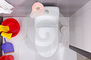 Overhead view of a toilet with cleaning products