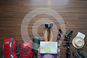 Overhead view of traveler woman plan and backpack planning