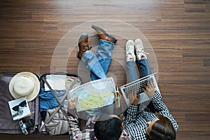 Overhead view of Traveler Young couple planning honeymoon vaca