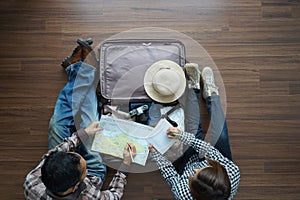 Overhead view of Traveler Young couple planning honeymoon vaca