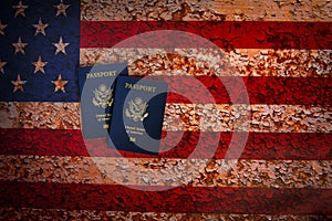Overhead view of two US passports on a rustic american flag background