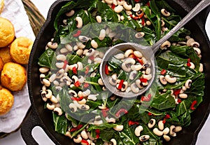 Close up of black-eye peas and collard greens