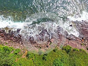 Overhead view of waves crashing on the rocky shore of Lake Superior