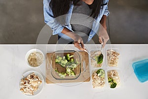 Overhead View Of Woman In Kitchen Preparing High Protein Meal