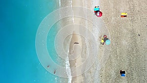 overhead view woman at sea beach with blue water