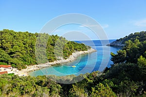 An overhead view of Zitna Beach, on a wonderfully spectacular bay with a small private hotel on the beach Korcula Island