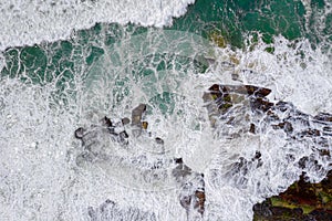 Overhead wave action over coastal rocks