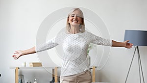 Overjoyed elderly woman satisfied with good healthy life