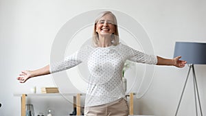 Overjoyed elderly woman satisfied with good healthy life photo