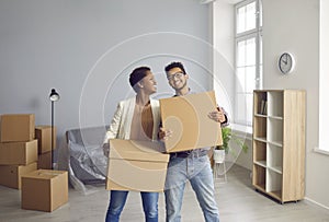 Overjoyed ethnic couple buyers celebrate moving to new home