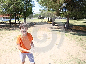 Overjoyed kid laugh in the Park in summer