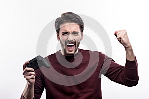 Overjoyed man celebrating victory in video game