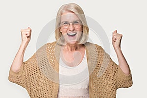 Overjoyed mature woman feel euphoric with good news