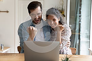 Overjoyed millennial couple excited with lottery win