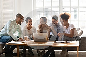 Overjoyed multiethnic students have fun studying together