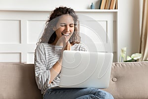 Overjoyed young woman feeling excited about good news.