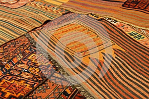 Overlapping carpets with intricate Kurdish patterns