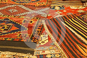 Overlapping carpets with intricate Kurdish patterns