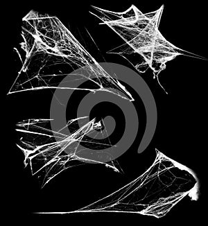 Overlay the cobweb effect. A collection of spider webs isolated on a black background. Spider web elements as decoration to the de