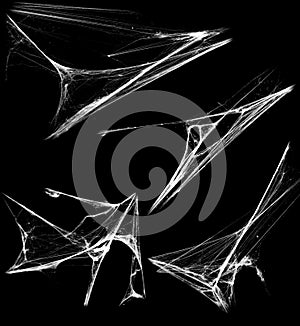 Overlay the cobweb effect. A collection of spider webs isolated on a black background. Spider web elements as decoration to the de