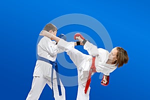 With overlays on the hands the children are beating karate blows