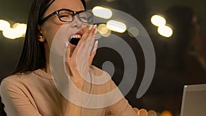 Overloaded sleepy lady yawning at workplace, having no new ideas, unemployment