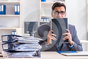 Overloaded with work employee under paperwork burden