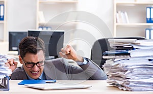 Overloaded with work employee under paperwork burden