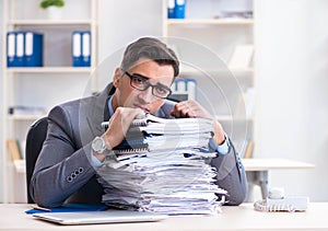 Overloaded with work employee under paperwork burden