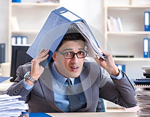 Overloaded with work employee under paperwork burden