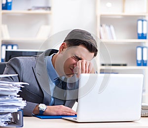 Overloaded with work employee under paperwork burden