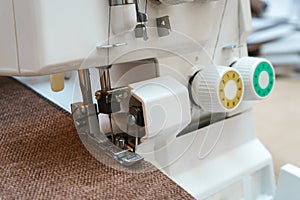 Overlock sewing machine in process. Professional equipment.