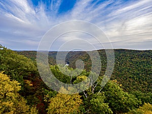 Overlook of the mountains and the fall foliage at Coopers Rock State Forest in West Virginia with the sunset golden sky one