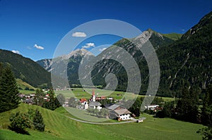 Overlook of the township of Holzgau amid the foothills of the Austrian Alps. photo