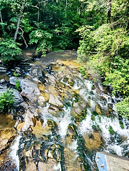 Overlook view of the bottom of the waterfall on a warm summer day