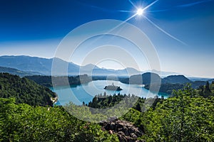 overlooking Bled lake panoramic vista in full summer sun